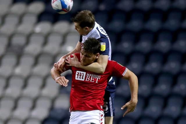 Paul Huntington in an aerial battle with Bristol Citys Chris Martin at Deepdale