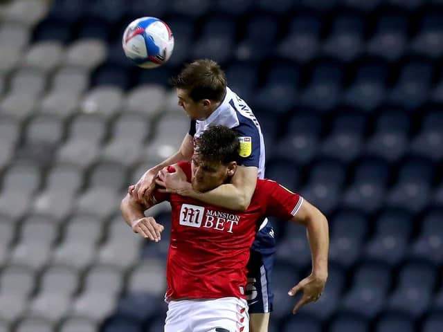 Paul Huntington in an aerial battle with Bristol Citys Chris Martin at Deepdale