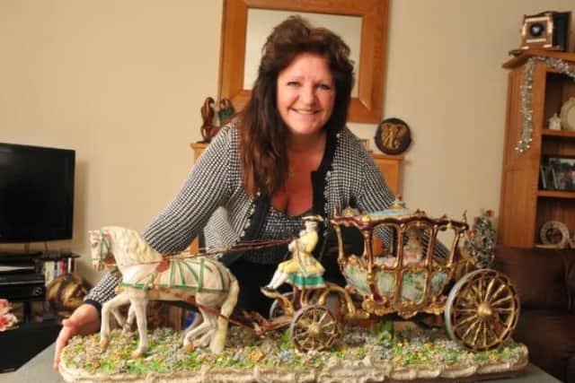 Jackie showing off her most difficult assignment yet - a Capodimonte coach and horses which needed months of work.