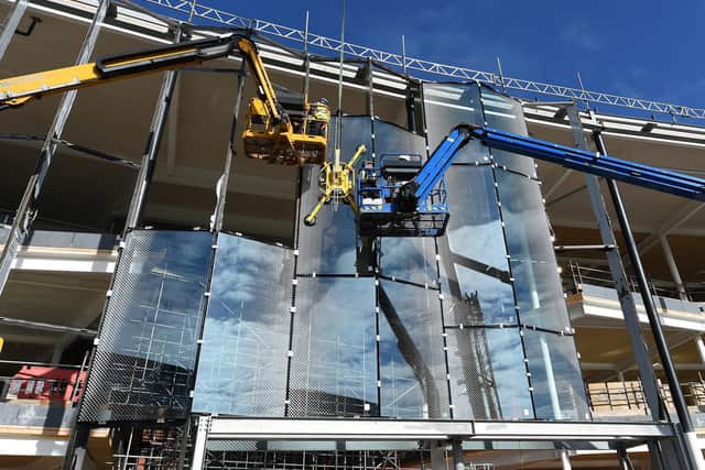 In a little over a month, nearly 100 tonnes of steel and glass have been lifted into place on the south elevation of the development, with the building now virtually watertight