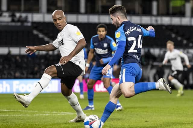 North End striker Sean Maguire looks for a way past Derby defender Andre Wisdom