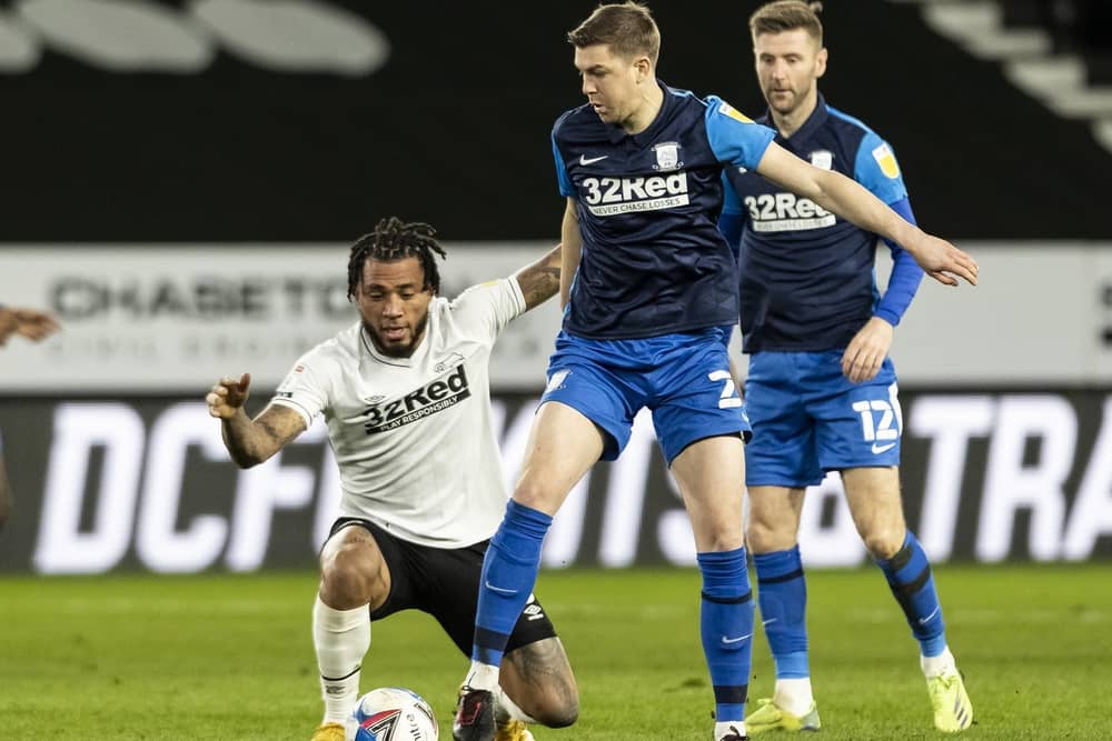Preston North End defender Paul Huntington challenges Derby striker Colin Kazim-Richards on Boxing Day