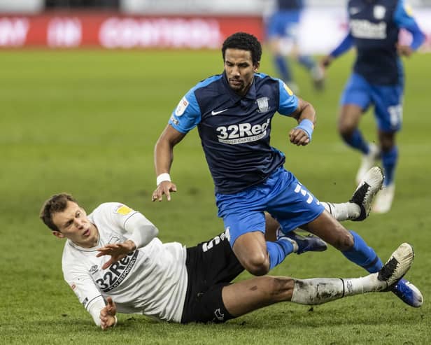 Preston North End winger Scott Sinclair is tackled by Derby's Krystian Bielik