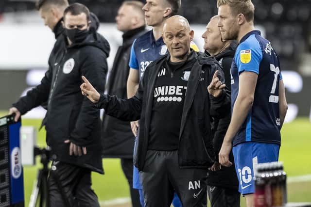 PNE manager Alex Neil gives instructions for substitutes Jayden Stockley and Emil Riis at Pride Park