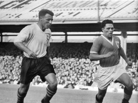 Tommy Docherty (left) in action for Preston North End