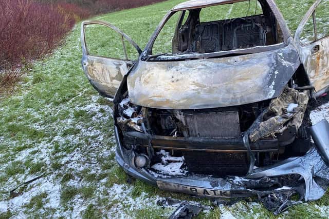 The 2008 model Peugeot was found torched next to a public footpath along Eaves Brook, near Brookfield Park, in Preston on Thursday (December 31). Pic: Ryan Gillett