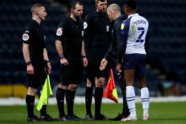 PNE manager Alex Neil and right-back Darnell Fisher argue their case to referee Tim Robinson at the final whistle