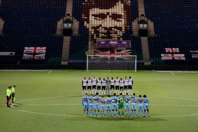 PNE and Coventry players observe a minute's silence before kick-off in a mark of respect to the North End fans and former players who died in 2020