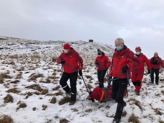 A casualty is transported off the moor to a waiting ambulance (Photo: Bolton Mountain Rescue).