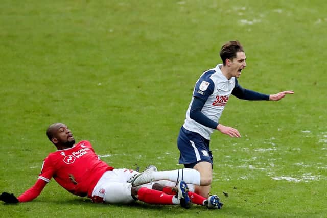 Preston North End midfielder Tom Bayliss is challenged by Nottingham Forest's Samba Sow at Deepdale