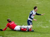 Preston North End midfielder Tom Bayliss is challenged by Nottingham Forest's Samba Sow at Deepdale
