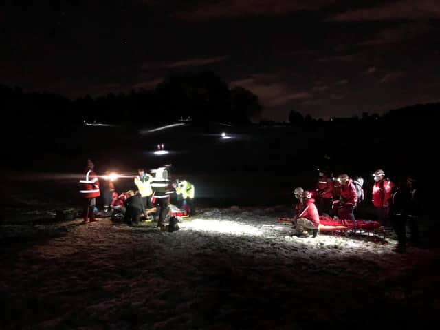 Bowland Pennine Mountain Rescue Team with a patient being treated by the rescue team doctor and team members