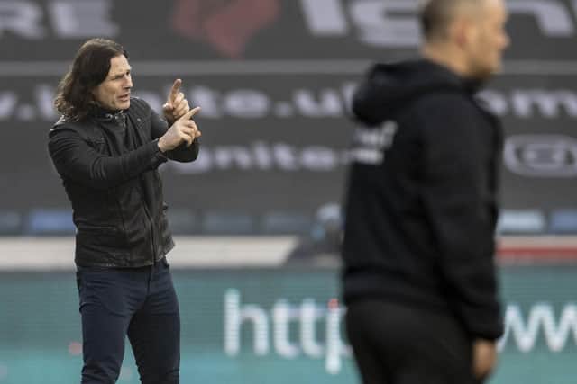 Gareth Ainsworth and Alex Neil on the touchline at Adams Park