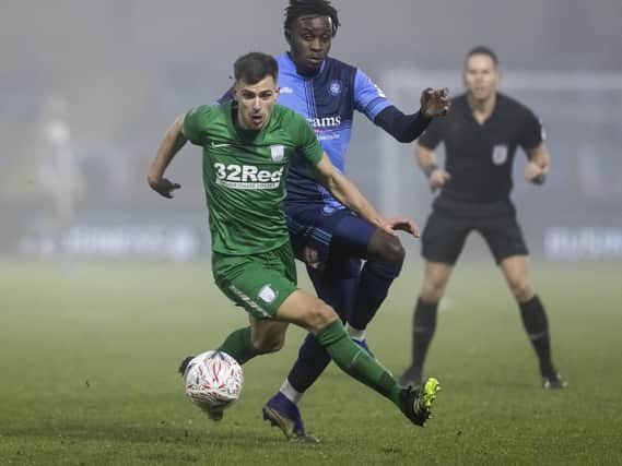 Preston North End's new boy Jayson Molumby breaks away from Wycombe Wanderers' Admiral Muskwe