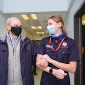 Geoffrey Mitchell is walked out of Lytham Primary Care Centre by Lancashire Fire and Rescue Service community safety officer Robyn Morris after having a Covid-19 vaccine on Wednesday, January 13, 2021 (Picture: Daniel Martino for JPIMedia)