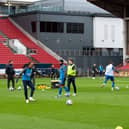 The Preston players warming up before the game.