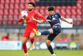 Nathaniel Knight-Percival (right) with Orient’s Lee Angol (photo: Getty Images)