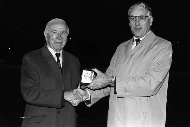 Sir Matt Busby presents a carriage clock to Preston North End chairman Alan Jones to mark PNE's centenary game in October 1981