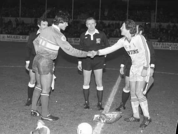 Preston North End skipper Gordon Coleman shakes hands with his Sydney Olympic counterpart in the friendly at Deepdale in November 1981