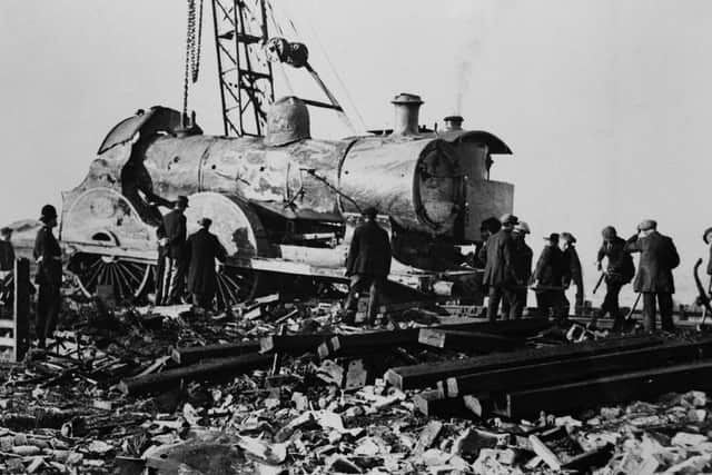 The engine amid the wreckage of the Warton signal box in the aftermath of the Lytham rail crash in Lancashire, 4th November 1924. The accident happened the previous day when the Liverpool express travelling to Blackpool derailed after one of the locomotive's front tyres fractured. Fourteen people were killed in the accident. (Photo by Topical Press Agency/Hulton Archive/Getty Images)