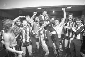 Current Chorley chairman and manager of the Magpies back in 1986 is held aloft by his players in the dressing rooms after the 3-0 win over Wolves in the FA Cup