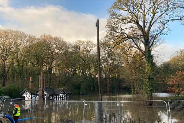 The Grade-II listed Ackhurst Lodge nearly fully submerged by floodwater.