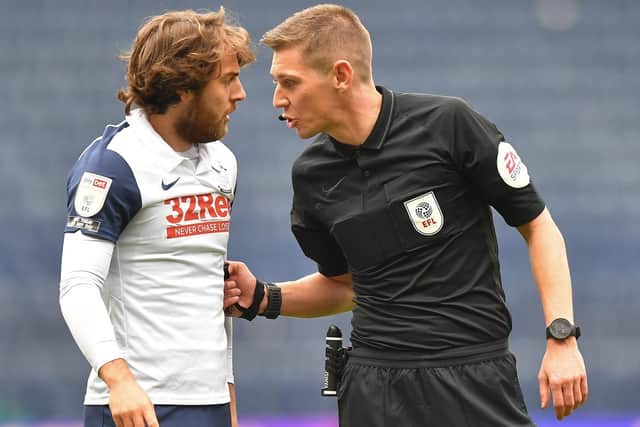 PNE midfielder Ben Pearson gets a ticking-off from referee Matt Donohue