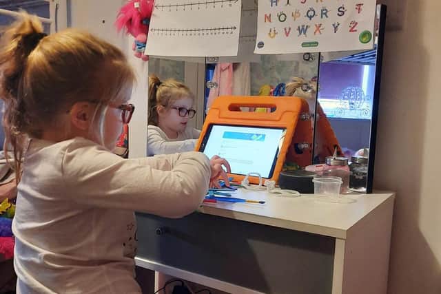 Five-year-old Summer has to complete school work whilst mum Katie works full time from home