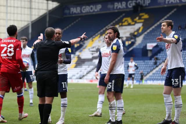 Referee Geoff Eltringham waves away PNE's protests after he awarded Reading a penalty at Deepdale