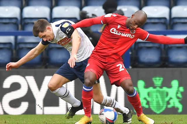 PNE midfielder Jayson Molumby challenges for the ball with Reading winger Sone Aluko