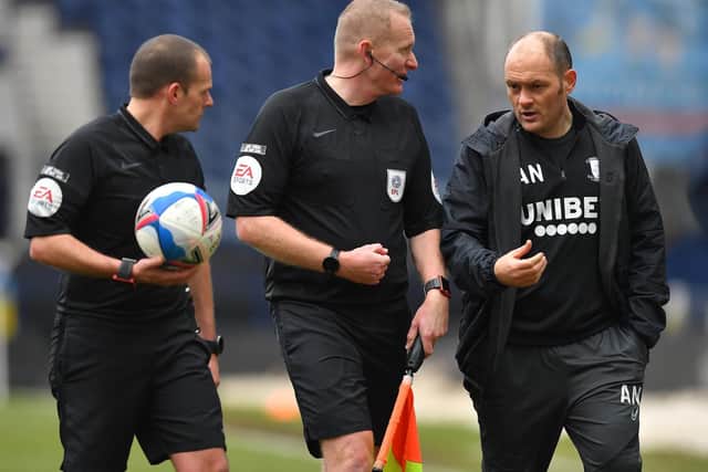 Preston North End manager Alex Neil has a word with referee Geoff Eltringham and one of his assistants at the final whistle