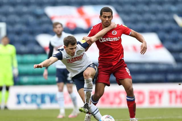 Preston North End midfielder Jayson Moulby battles for possession against Reading's Andy Rinomhota at Deepdale