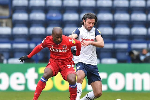 Preston North End left-back Joe Rafferty challenges Reading's Sone Aluko