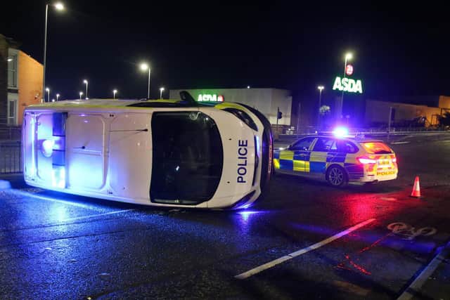 Police were responding to an emergency 999 call when the shocking smash took place in Bolton