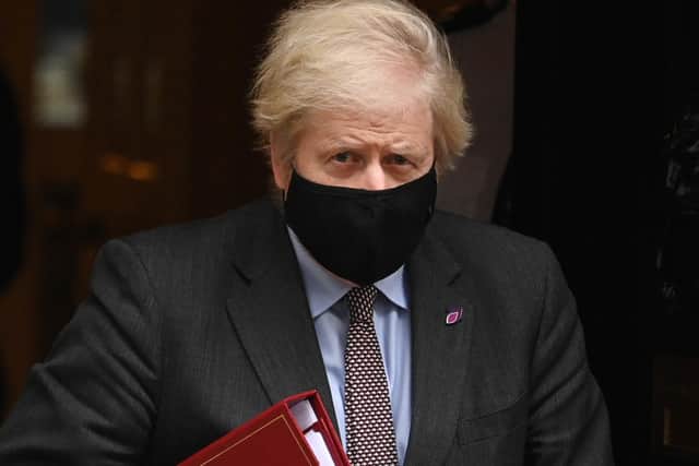 Prime Minister Boris Johnson leaves Downing Street for PMQ's on January 27
