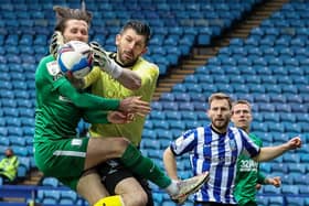 Preston North End skipper Alan Browne challenges Sheffield Wednesday goalkeeper Keiran Westwood at Hillsborough