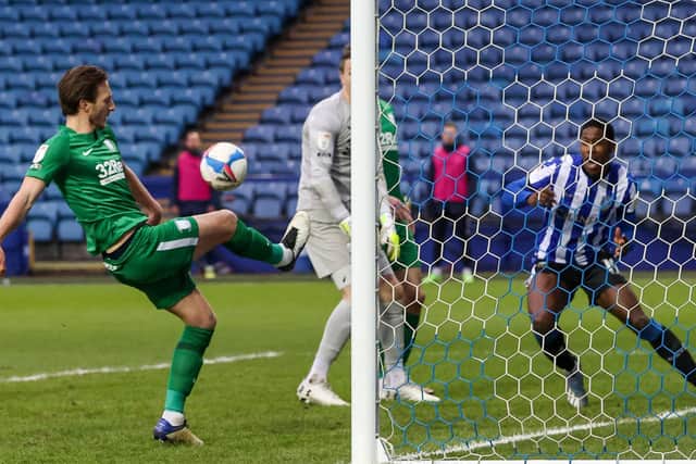 Ben Davies clears off the line at Hillsborough