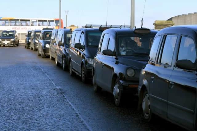 Taxis queue at Preston Railway Station.