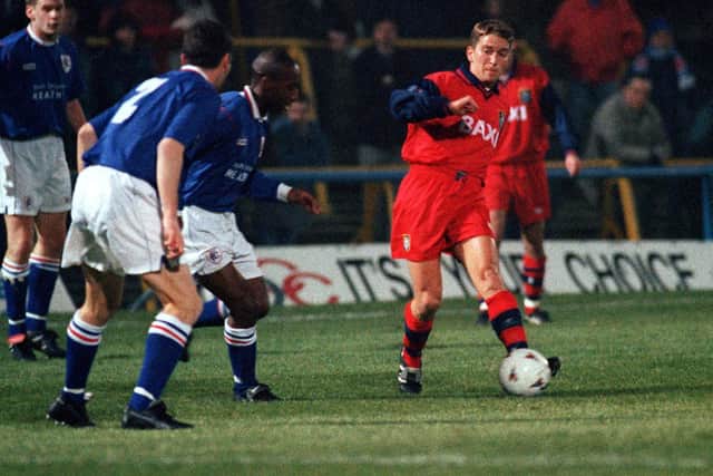 PNE midfielder Graeme Atkinson takes on two Chesterfield players