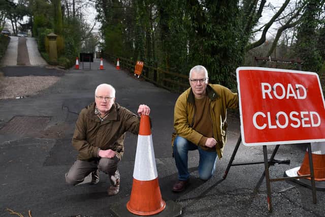 Mike Graham, right, with Steve Williams at the site of the sinkhole in Private Road, Hoghton