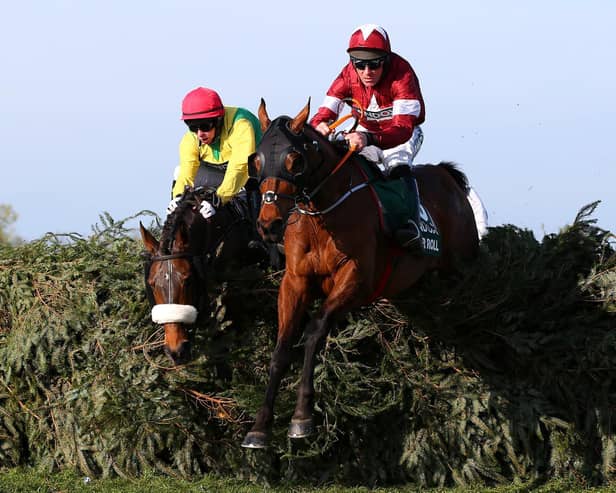 Davy Russell riding Tiger Roll clears the final fence as he races to victory in the 2019 Randox Health Grand National at Aintree