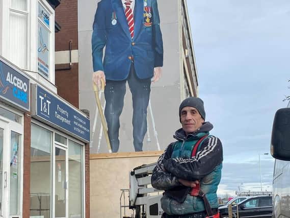 Robert Newbiggin and his mural in Southport