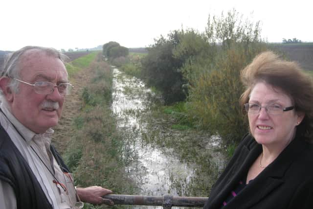 MP Rosie Cooper looking at flooding in West Lancashire with an affected land owner