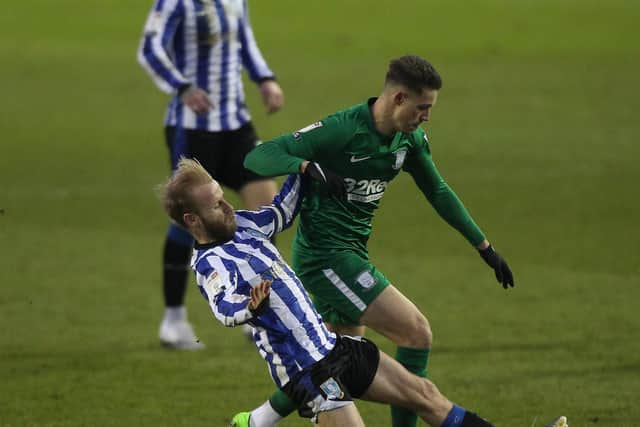 Preston winger Billy Bodin is challenged by Sheffield Wednesday midfielder Barry Bannan at Hillsborough