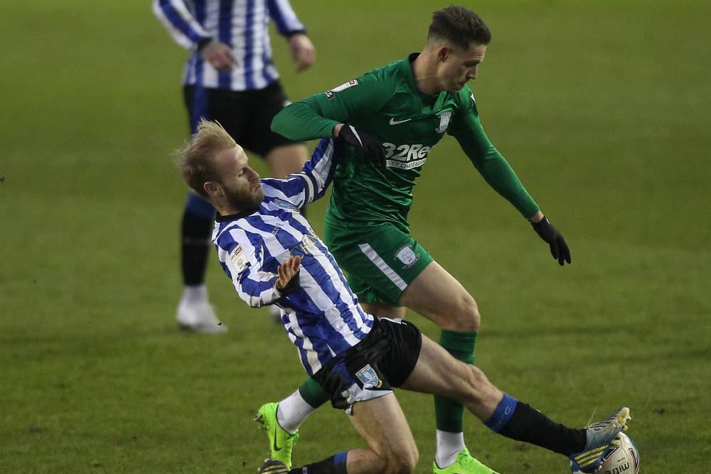 Preston winger Billy Bodin is challenged by Sheffield Wednesday midfielder Barry Bannan at Hillsborough