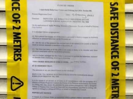 The court's closure order taped to the gym doors.