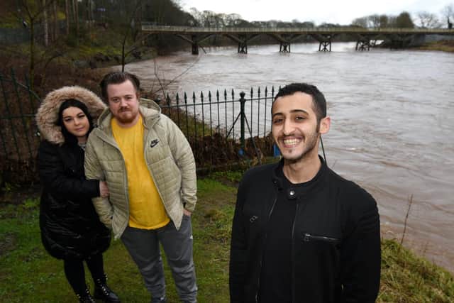 Dean Lowe, centre, feels lucky to be alive after he jumped into the fast flowing River Ribble to try and save his pet puppy who fell in on a walk through Avenham Park, Preston, Turki Al-Shammari, right, a Saudi student helped rescue Dean and pulled him to safety, pictured with Dean's partner Jessica Williams, left