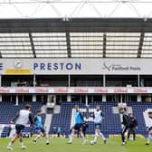 The PNE players warm up before the game.