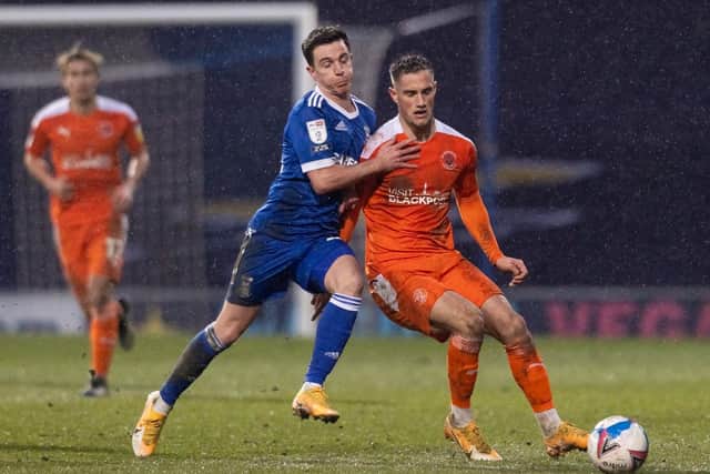 Josh Harrop challenges for the ball during his Ipswich debut against Blackpool at Portman Road on Saturday