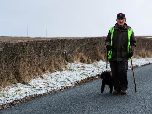 Philip with his four-legged friend Freddie completing his epic walking challenge for a good cause